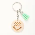 Portachiavi in legno segno zodiacale Acquario con un elegante nappa verde menta - Acquario / Verde menta