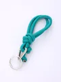 Detail of turquoise PU leather braided strap with silver key ring and carabiner. - Cyan (20846)