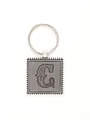 Detail view of the artistic letter C embossed on a grey leather and silver keychain - Letter C Style (20718)