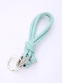 Detailed macro view of a hand-woven mint green PU leather lanyard with silver keychain - Mint Green (20843)