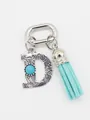 Bohemian western style initial D keychain with turquoise stone and light blue tassel charm. - Letter D