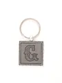 Macro view of embossed letter G on a vintage style square leather keychain - 20722