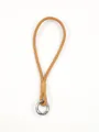 Close-up of handmade camel brown leather phone wrist strap with silver spring clasp - Camel