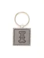 Macro detail of decorative embossed leather letter I keychain with zinc alloy beaded frame. - 20724