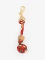 Handmade red pattern woven ball keychain featuring natural wooden bead and gold clasp - Traditional Print Red (22607)