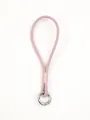 Detail of a pink handmade leather phone wrist strap with silver ring clasp. - Pink