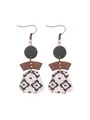 Detail of Bohemian multi-layer geometric earrings with black pattern on natural cork - Wave Pattern Style (12120)