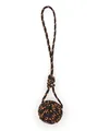 Macro view of handmade black and orange polyester monkey fist knot keychain pendant - Black Orange Dotted (21997)
