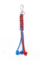 Macro view of hand-woven corn knot paracord keychain in vibrant blue and orange dual colors. - Blue and Red Contrast
