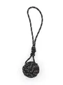 Close-up of a hand-woven black polyester monkey fist knot keychain charm for bags - Black White Spotted (22004)