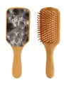 Bamboo hairbrush detail showing cowhide pattern back and massaging bristles. - Black and White Cow Print Style (41293)