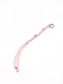Close-up view of a pink handmade braided polyester rope keychain with a silver ring - Woven Rope Charm (21126) / Light Pink