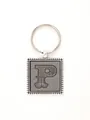 Vintage silver zinc alloy keychain featuring a stylized letter P embossed on grey leather. - 20731
