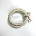 Detailed close-up of beige PU leather round cord with cross-grain stitching for DIY crafts - Beige (00007)