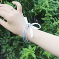 Silver silicone jelly bangles set of 5 with white ribbon bow on wrist. - 5 Pieces / Silver (2#)