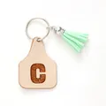 Farm style leather ear tag keychain featuring letter C and a mint green tassel pendant - Letter C Style (20433)