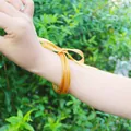 Set of five flexible gold foil glitter jelly bangles with a decorative yellow ribbon - 5 Pieces / Gold (16#)