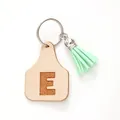 Personalized beige leather cow tag keychain with letter E and mint green suede tassel - Letter E Style (20435)