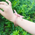 Stackable pink jelly bangles with a pink ribbon bow for a feminine look - 5 Pieces / Light Pink (18#)