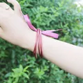 Elegant dark pink 5-piece jelly bangles set made of flexible silicone on the wrist. - 5 Pieces / Rose Red (20#)