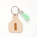 Minimalist cow tag leather keychain with embossed letter I and mint green tassel - Letter I Style (20439)