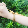 Thin gold foil jelly bangles set of 5 worn on wrist decorated with a yellow ribbon - 5 Pieces / Bright Gold (22#)