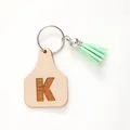 Minimalist cattle tag leather keychain with letter K engraving and green suede tassel - Letter K Style (20441)