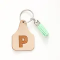 Minimalist keychain featuring a leather tag with letter P and a green tassel pendant - Letter P Style (20446)