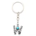Vintage silver alloy letter W keychain with turquoise stone and ethnic engravings - 20500