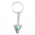 Vintage silver alloy letter V keychain featuring blue turquoise stone and engraved patterns - 20499