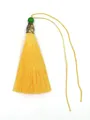 Detailed view of a bright yellow polyester tassel with a green bead and metal cap - Green Bead & Alloy Cap Style / Yellow