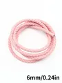 Detailed macro view of pink 6mm braided PU leather cord for craft and accessory making - Three-Strand Twisted Style (00117)