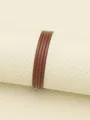 Close-up of brown four-fold flat PU leather cord for DIY necklace and jewelry making. - 2.5mm*2mm (1 Meter/Pack) / Reddish Brown/Caramel (00359)