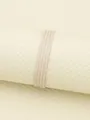 Detailed close-up of beige four-fold flat PU leather cord for DIY jewelry making material - 2.5mm*2mm (1 Meter/Pack) / Off-White/Beige (00360)