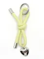 Close-up detail of a handmade yellow leather knot keychain with a silver heart charm - Woven Lanyard (21681-2)