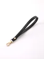 Durable black faux leather wristlet strap featuring a premium gold-tone lobster clasp - Black
