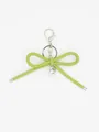 Detail view of a lime green leather bow keychain with silver heart charm and lobster clasp. - Bowknot Charm (22422)