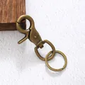 Vintage messingkleurige legering sleutelhanger met een functionele draaibare ring - Bronskleur (20209)