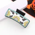 Detailed macro shot of western cowboy cow print and sunflower pattern on hair claw clip. - Cow Print Sunflower Style (90005)