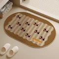 Brown oval woven linen bath mat featuring a cute dachshund pattern and non-slip bottom - Oval / 40x60cm / Retro Dog Brown