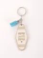 Porte-clés en bois avec pompon bleu et texte gravé au laser Apartment Sweet Apartment - Étiquette Motel Ovale Citation 4 (20353)