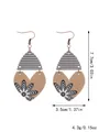 Detail view of heart-shaped wooden earrings with floral patterns and size annotations. - Black and White Heart Floral (11626)