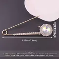 Detailed size view of metal rhinestone safety pin brooch with large circular crystal - Round Faceted Crystal Style / Gold