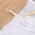 Elegant silver metal safety pin brooch featuring seven white pearl embellishments - Pearl String Large Brooch / Silver