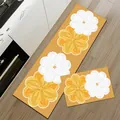 Detailed view of floral kitchen mats set on wood floor next to white cabinets - Style C (Absorbent Leather) / 1 Piece (40x60cm)