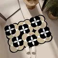 Moderne florale geometrische rutschfeste Badematte in Schwarz und Beige Textur - Impressionistischer Stil F
