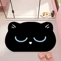 Süße schwarze badezimmermatte in katzenform aus kieselgur mit niedlichem gesicht - Schlafende blaue Katze
