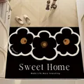 Elegant black entrance doormat featuring white floral outlines and Sweet Home slogan - 40*60cm / Black base with white and black floral design