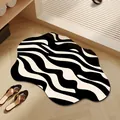 Modern irregular non-slip bathroom rug featuring a bold black and white wavy zebra pattern - 40x60cm (Absorbent Leather) / Minimalist Wave Style (B)