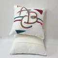 Close-up of white cushion cover featuring a creative pencil-style ABC alphabet print - Letter Style / 45x45cm (With Core)